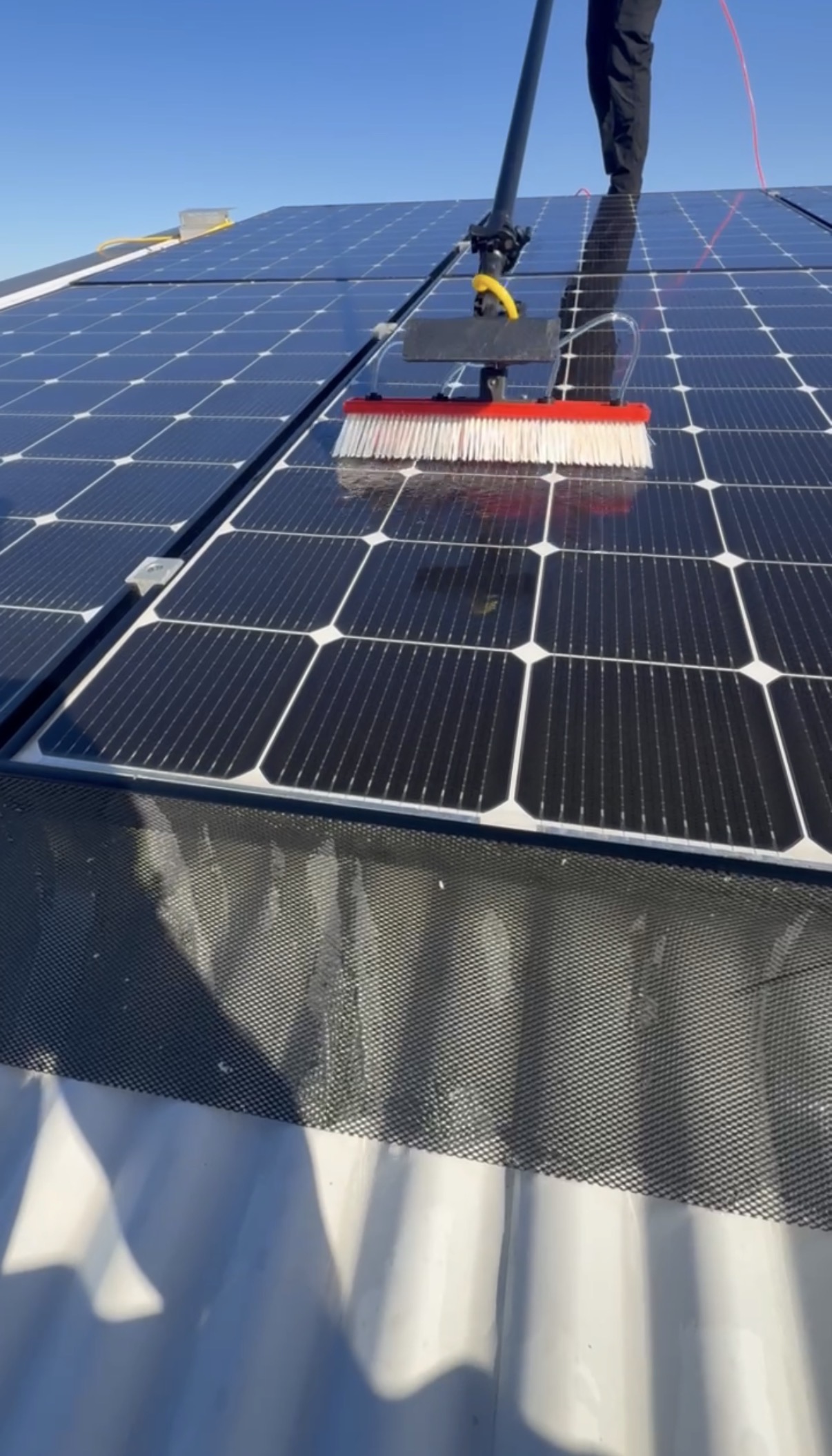 Solar panel cleaning on roof